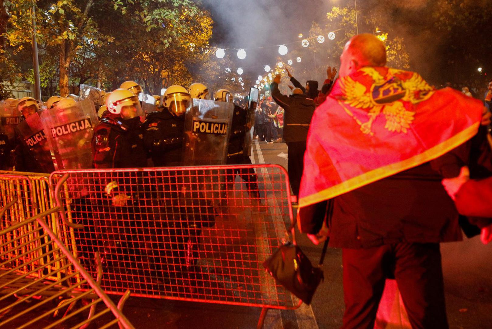 Police officers push protestors during a protest against the adoption of a law to limit presidential powers in Podgorica, Montenegro, December 12, 2022. REUTERS/Stevo Vasiljevic Photo: STEVO VASILJEVIC/REUTERS