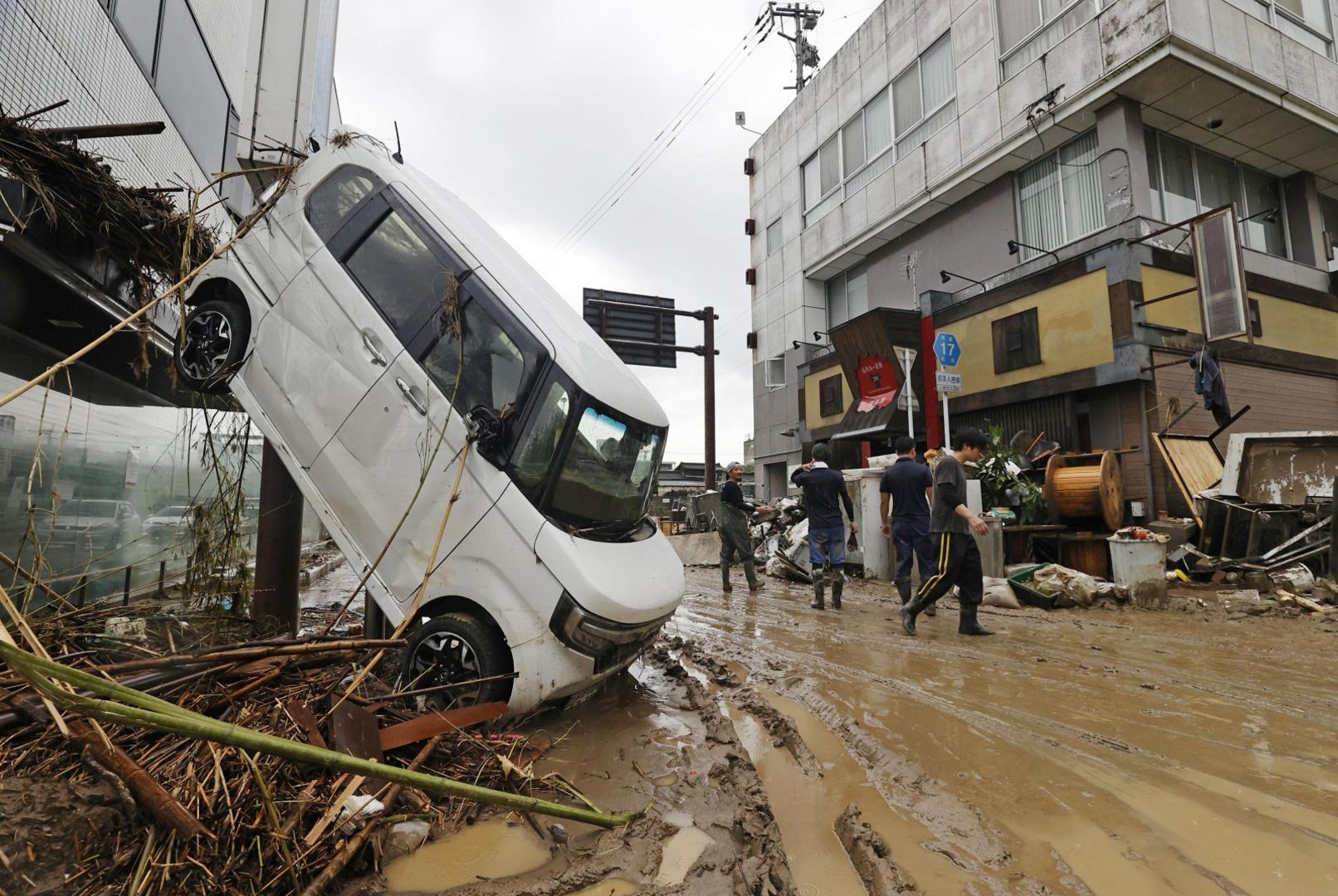 A car is left upended on a street in the flood-ravaged city of Hitoyoshi in Kumamoto Prefecture, southwestern Japan, on July 7, 2020, after deadly torrential rain. (Kyodo)
==Kyodo
 Photo via Newscom Newscom/PIXSELL