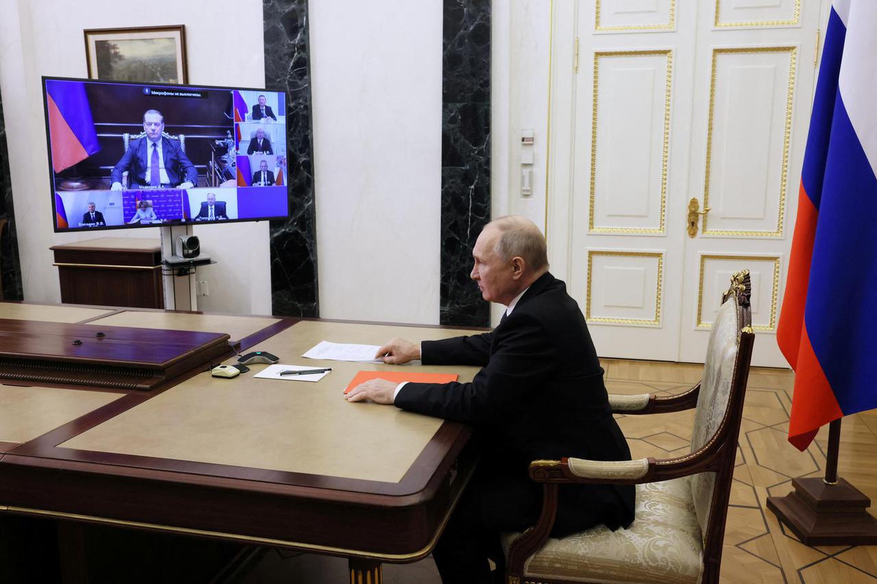 Russian President Vladimir Putin chairs a Security Council meeting in Moscow