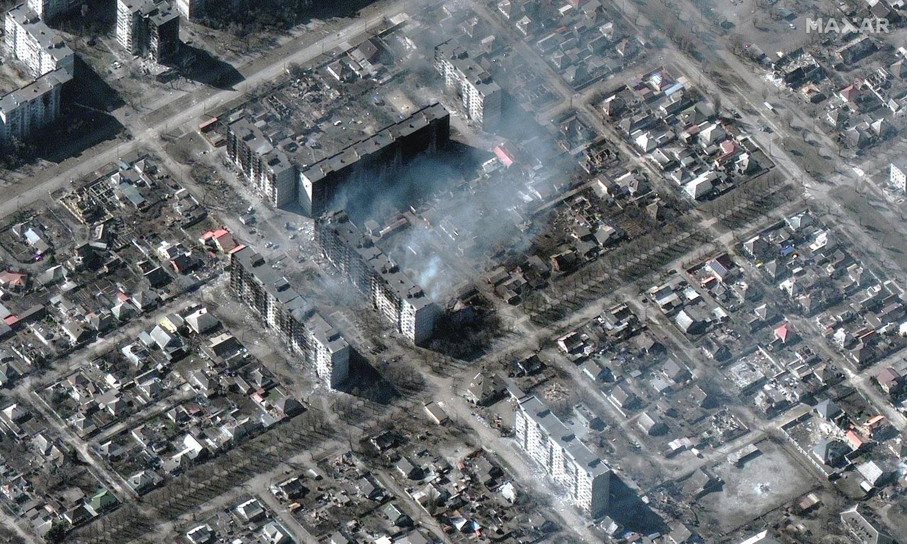 A satellite image shows burning and destroyed apartment buildings, in Mariupol, Ukraine, March 22, 2022. Satellite image ©2022 Maxar Technologies/Handout via REUTERS ATTENTION EDITORS - THIS IMAGE HAS BEEN SUPPLIED BY A THIRD PARTY. MANDATORY CREDIT. NO RESALES. NO ARCHIVES. DO NOT OBSCURE LOGO. Photo: MAXAR TECHNOLOGIES/REUTERS