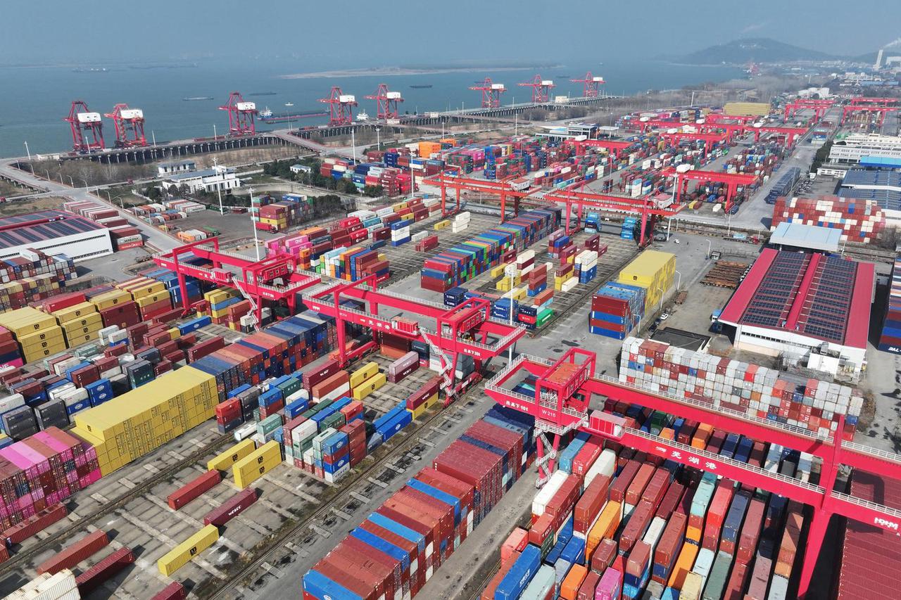 Containers and cargo ships at a port in Wuhu