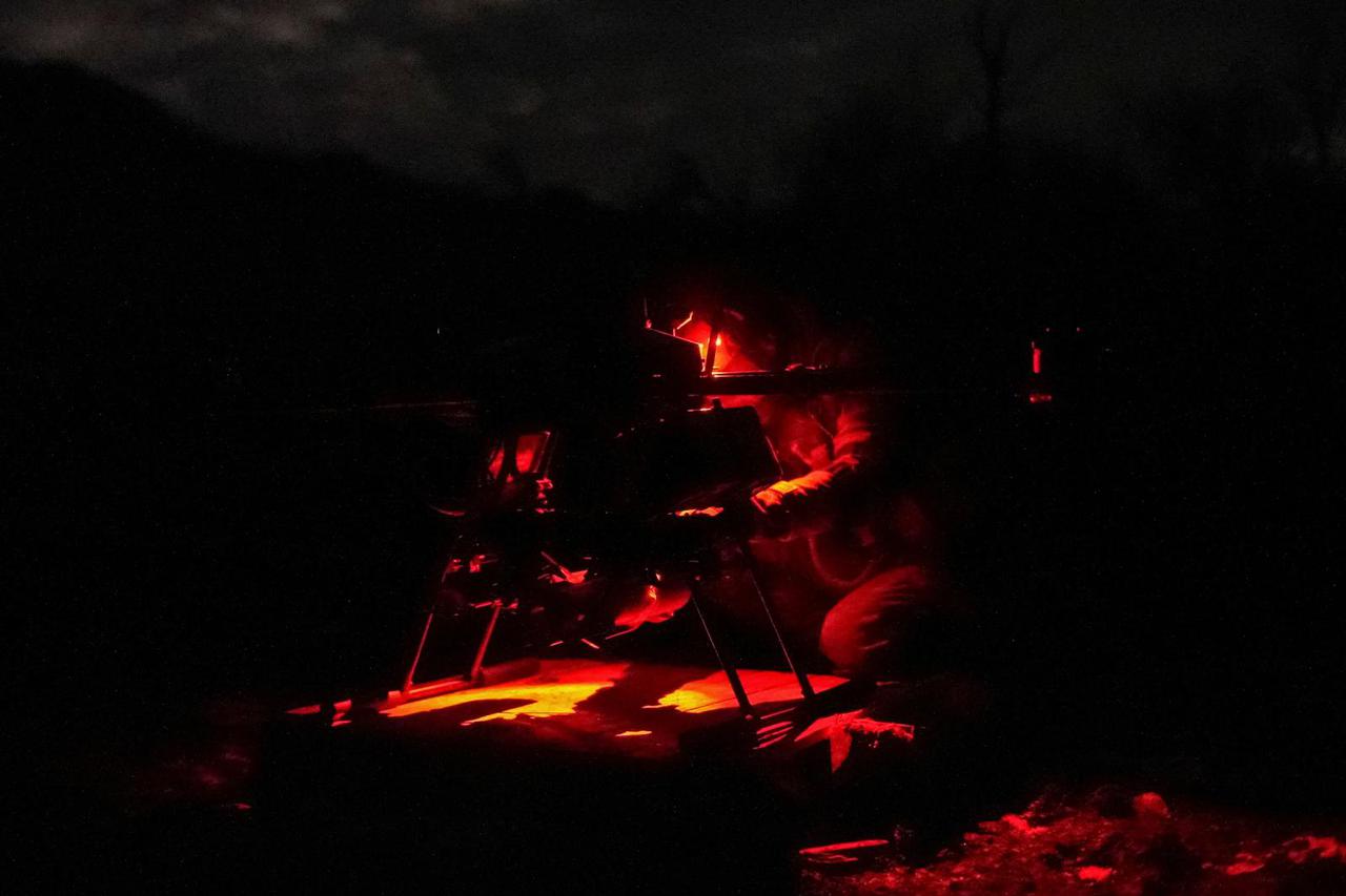 Ukrainian serviceman prepares a Vampire combat drone before flying over positions of Russian troops near the frontline town of Bakhmut