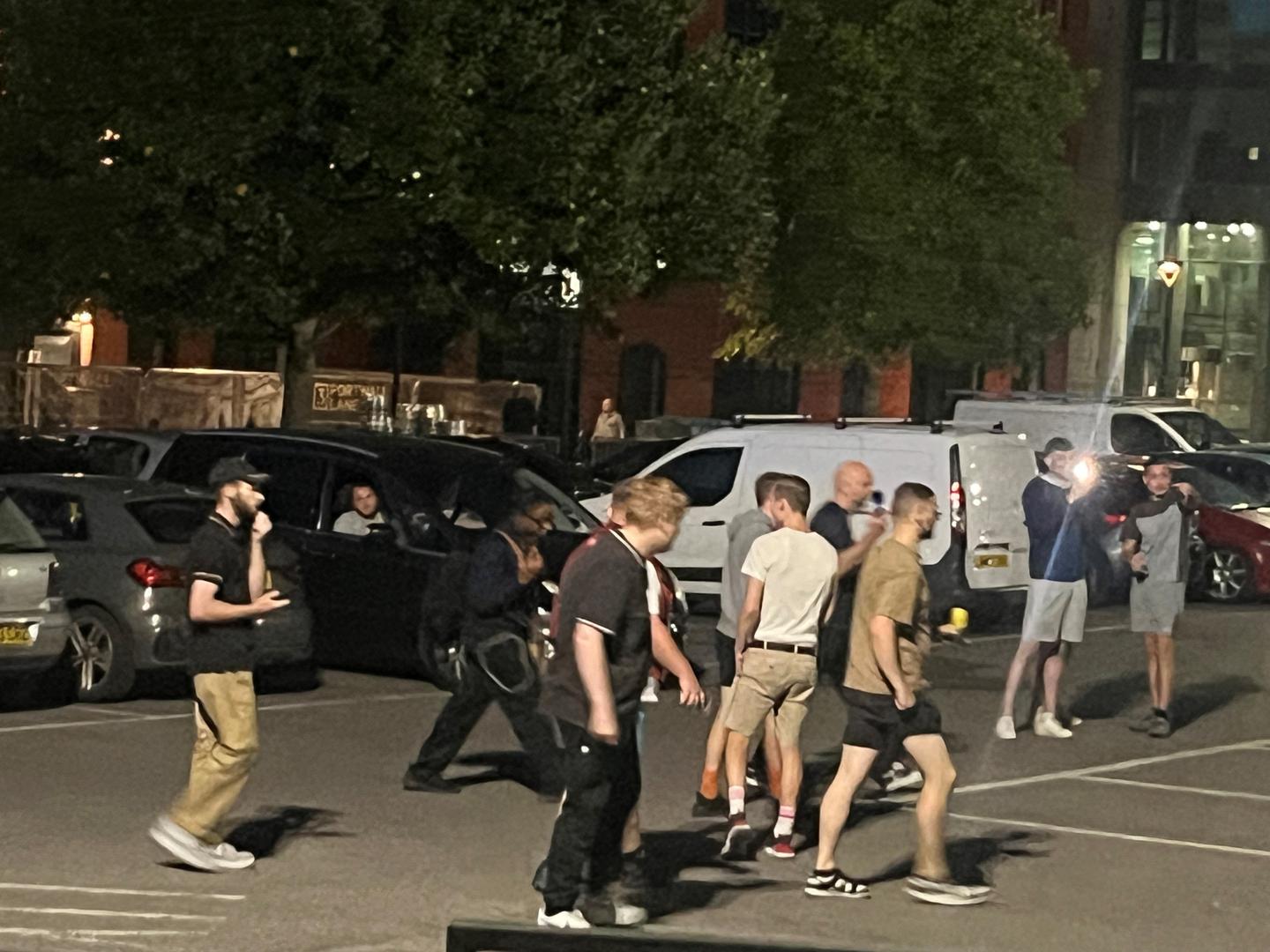 BEST QUALITY AVAILABLE Police watch a group of people who congregated in a car park in Redcliff Street, Bristol, opposite a hotel that has been used to house asylum seekers, after a protest in Bristol, following the stabbing attacks on Monday in Southport, in which three young children were killed. Picture date: Saturday August 3, 2024. Photo: Rod Minchin/PRESS ASSOCIATION