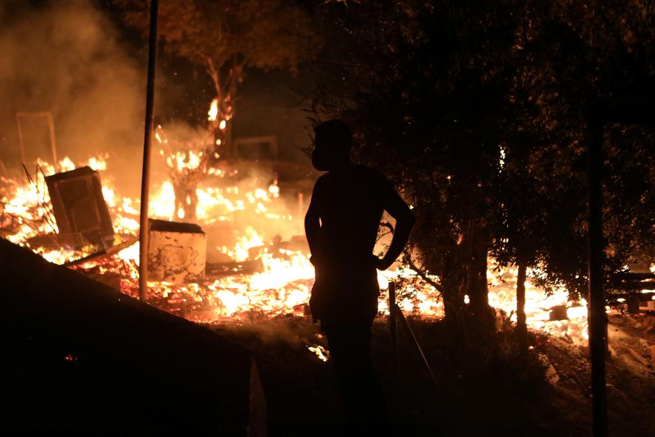 Fire burns at the Moria camp for refugees and migrants on the island of Lesbos