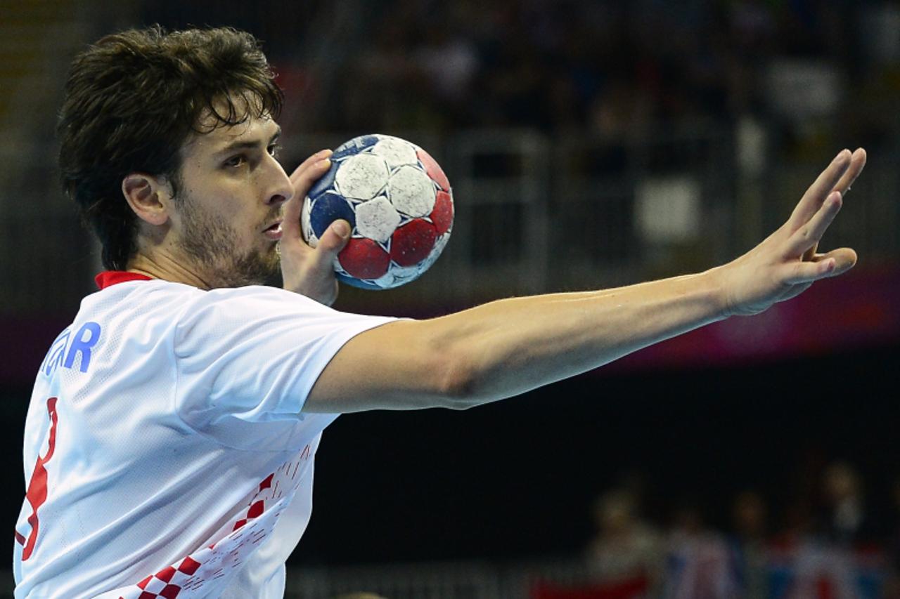 'Croatia\'s rightback Marko Kopljar attempts a shot during the men\'s bronze medal handball match Hungary vs Croatia for the London 2012 Olympics Games on August 12, 2012 at the Basketball Arena in Lo