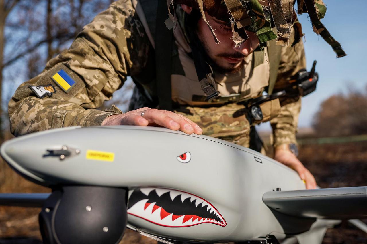 Serviceman checks the Shark drone before launching in Kharkiv region