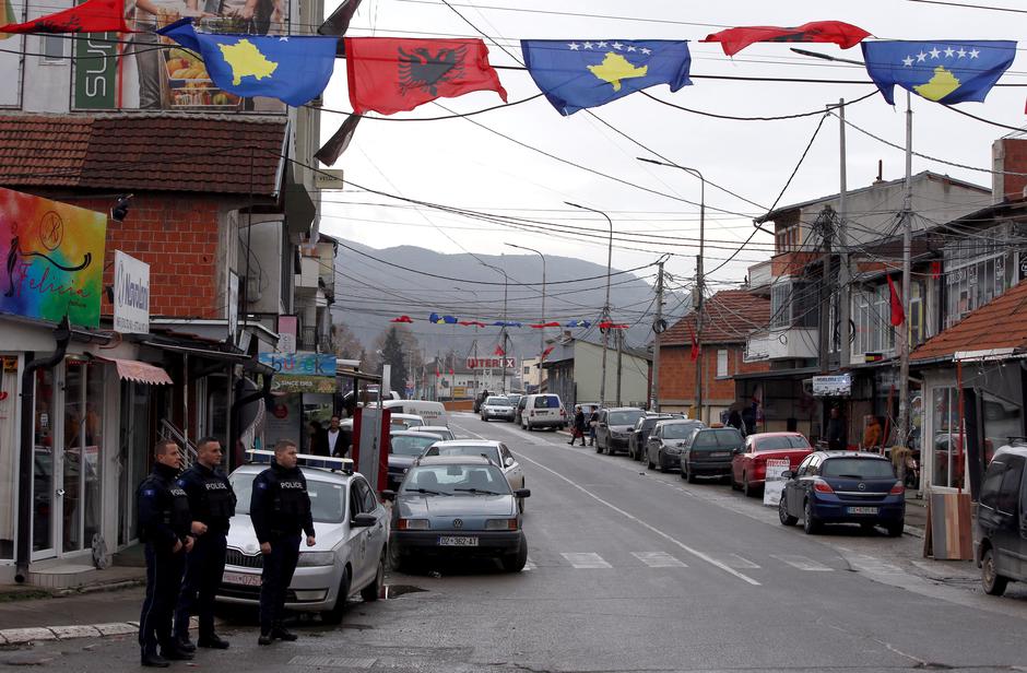 Kosovo police officers patrol in ethnically mixed area in North Mitrovica