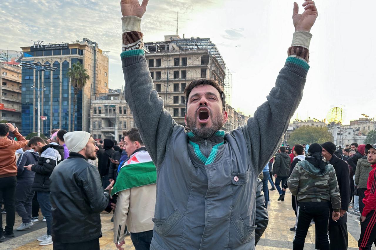 A man gestures at Saadallah al-Jabiri Square