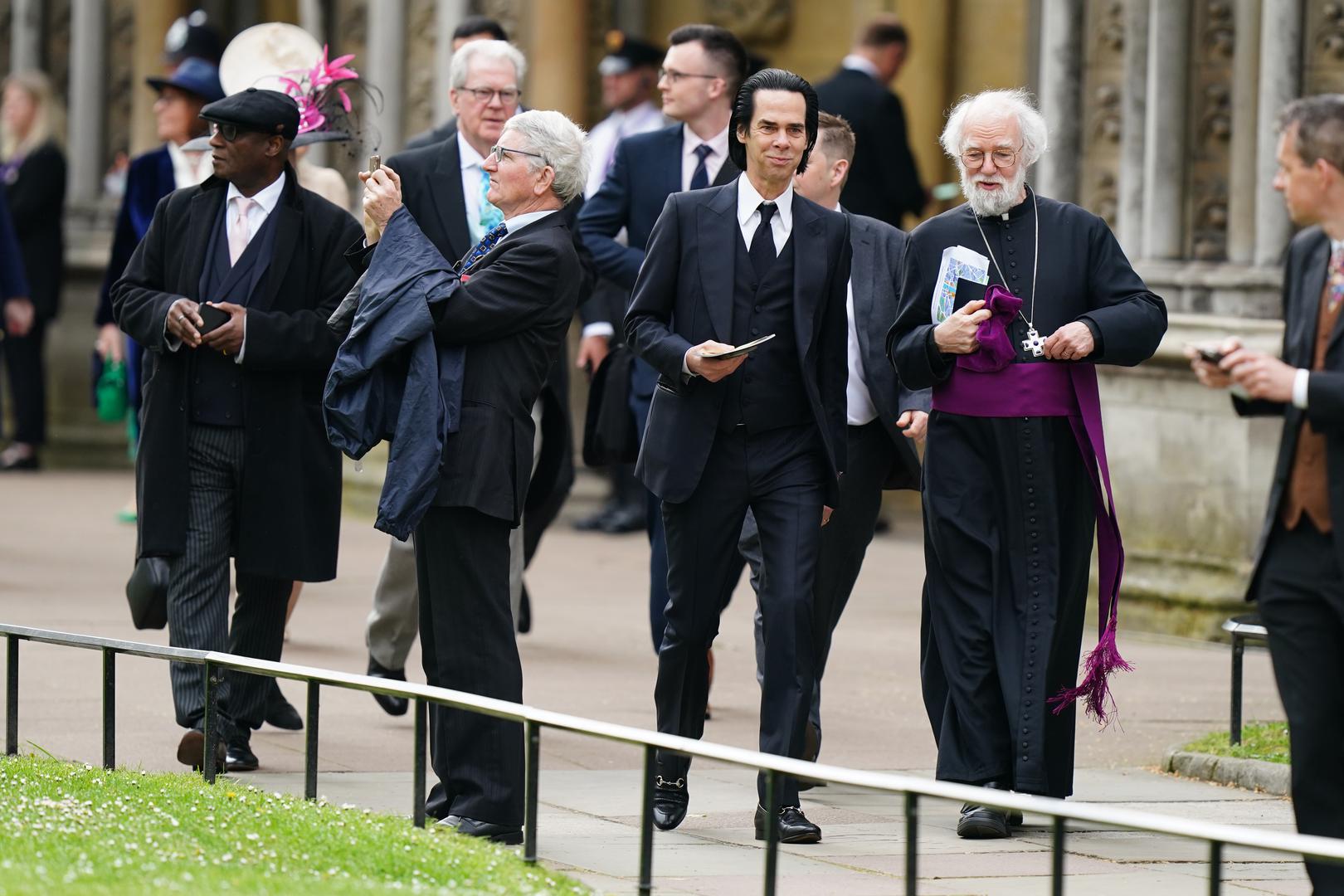 Nick Cave (centre) arriving ahead of the coronation ceremony of King Charles III and Queen Camilla at Westminster Abbey, London. Picture date: Saturday May 6, 2023. Photo: Jane Barlow/PRESS ASSOCIATION