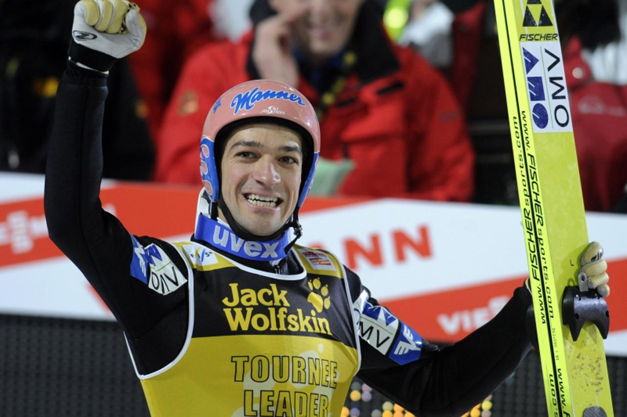 'Austria\'s Andreas Kofler celebrates in the finish area his victory in the Four Hills FIS ski jumping championship in Bischofshofen on January 6, 2010. Janne Ahonen of Finland placed second and Wolfg