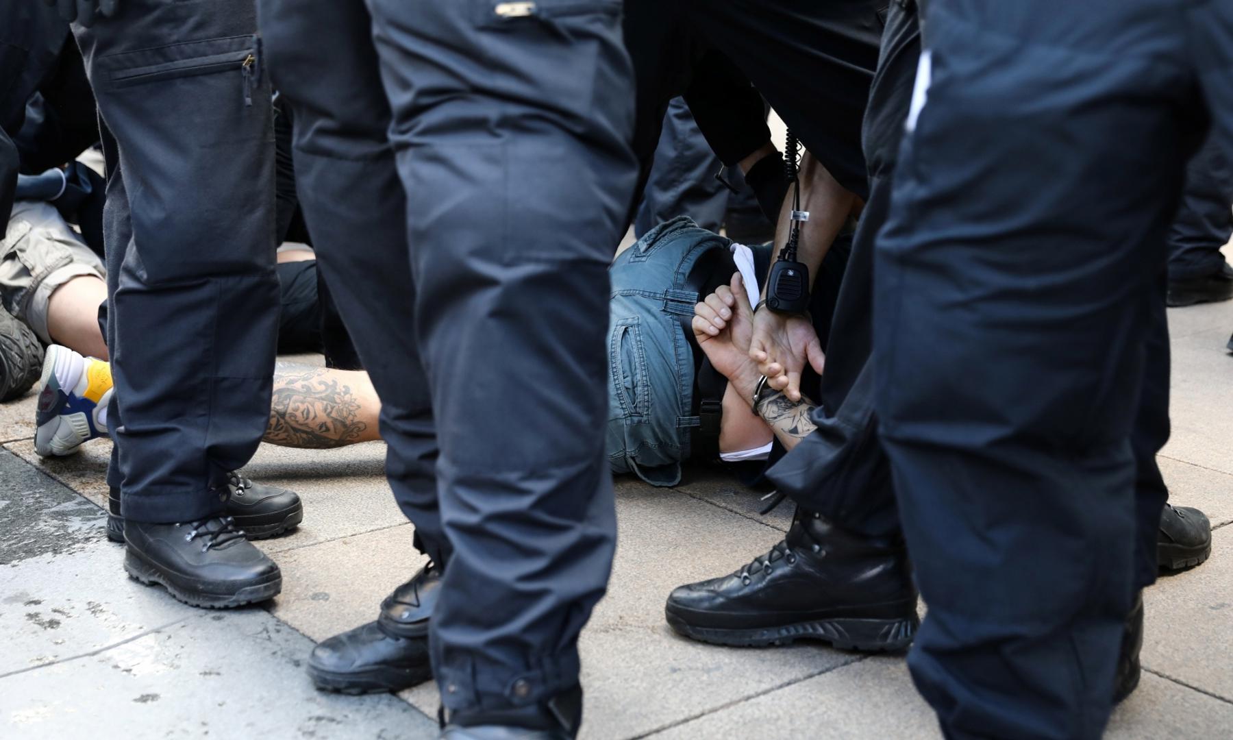 Protest during the coronavirus disease (COVID-19) outbreak in Berlin A protester is detained by police officers during a demonstration at Alexanderplatz, amid the spread of the coronavirus disease (COVID-19), in Berlin, Germany, May 9, 2020. REUTERS / Christian Mang CHRISTIAN MANG