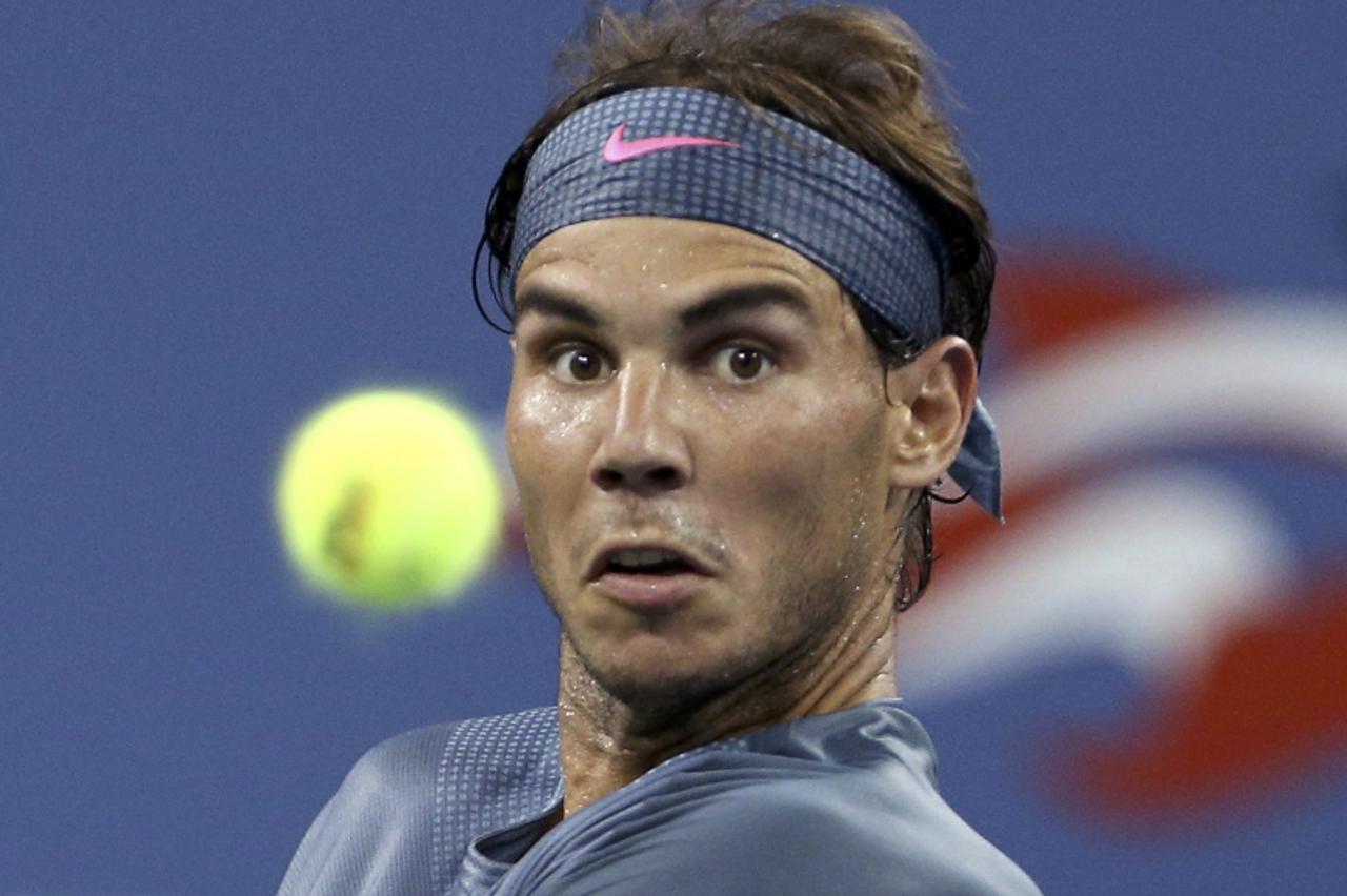 'Rafael Nadal of Spain gets set to return volley to Philipp Kohlschreiber of Germany at the U.S. Open tennis championships in New York September 2, 2013. REUTERS/Adam Hunger (UNITED STATES  - Tags: SP