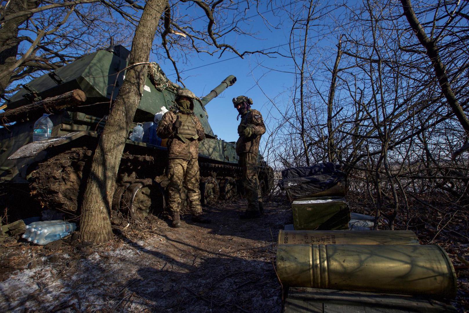 Ukrainian servicemen stand next to a 2S3 Akatsiya self propelled howitzer at their position in a frontline, amid Russia's attack on Ukraine, in Donetsk region, Ukraine January 8, 2023. REUTERS/Anna Kudriavtseva Photo: Stringer/REUTERS