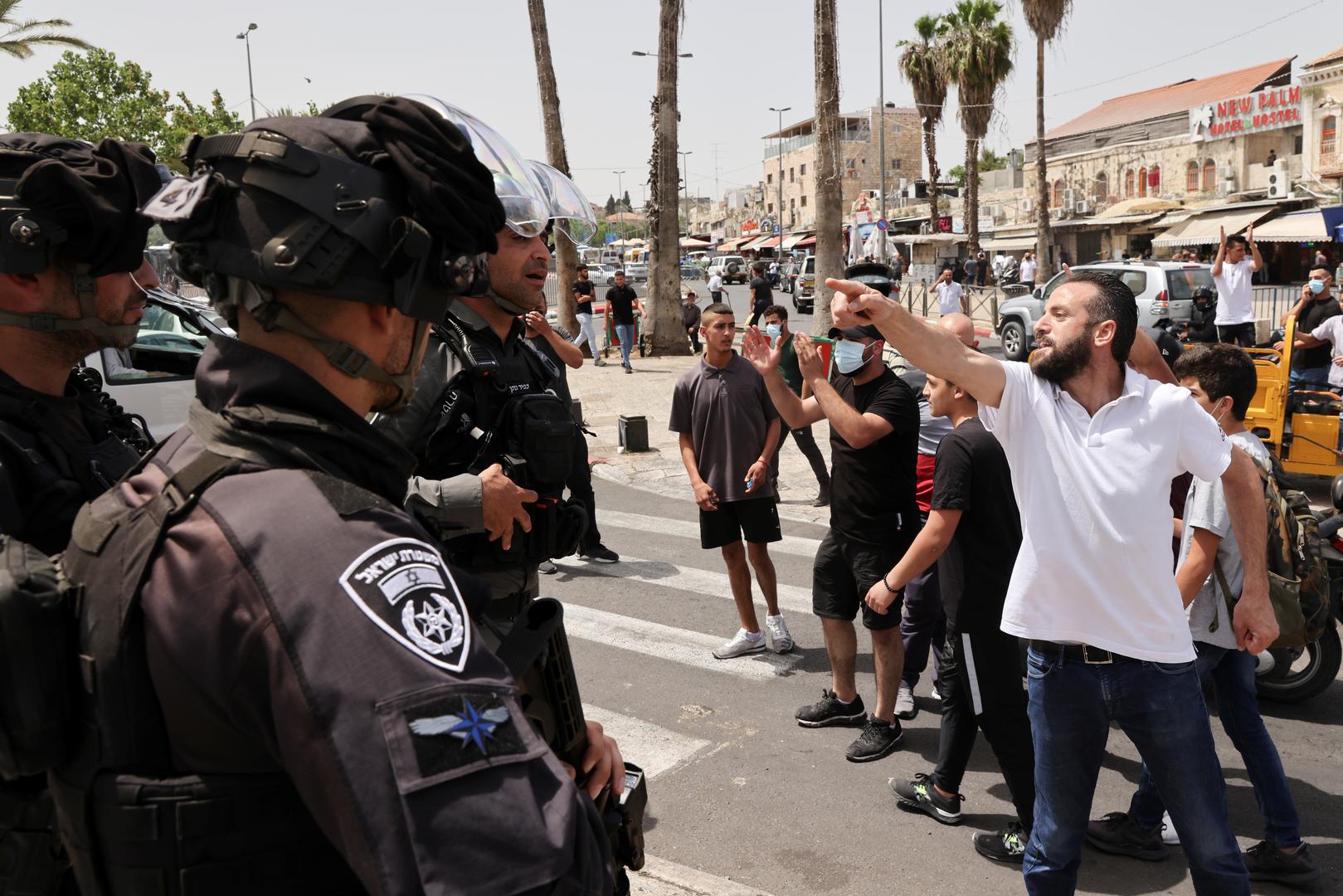 Violence flares at al-Aqsa mosque as Israel marks Jerusalem Day A Palestinian man gestures near Israeli security forces amid Israeli-Palestinian tension as Israel marks Jerusalem Day, near Damascus Gate just outside Jerusalem's Old City May 10, 2021. REUTERS/Ronen Zvulun RONEN ZVULUN