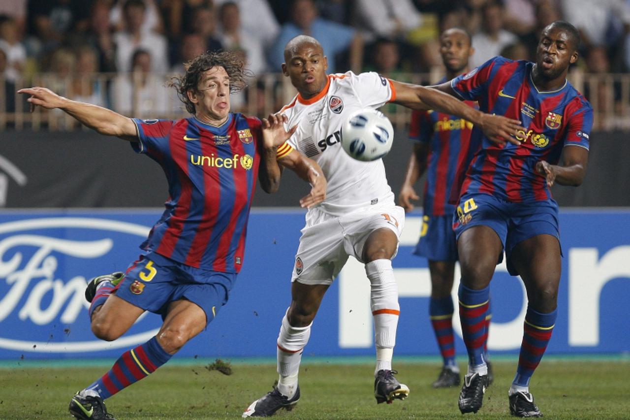 Carles Puyol, Luis Adriano, Yaya Toure