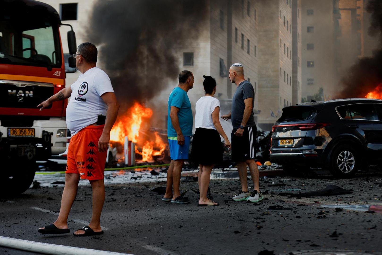 People react on the road, in the aftermath of rocket barrages that were launched from Gaza, in Ashkelon, Israel October 7, 2023. REUTERS/Amir Cohen Photo: AMIR COHEN/REUTERS