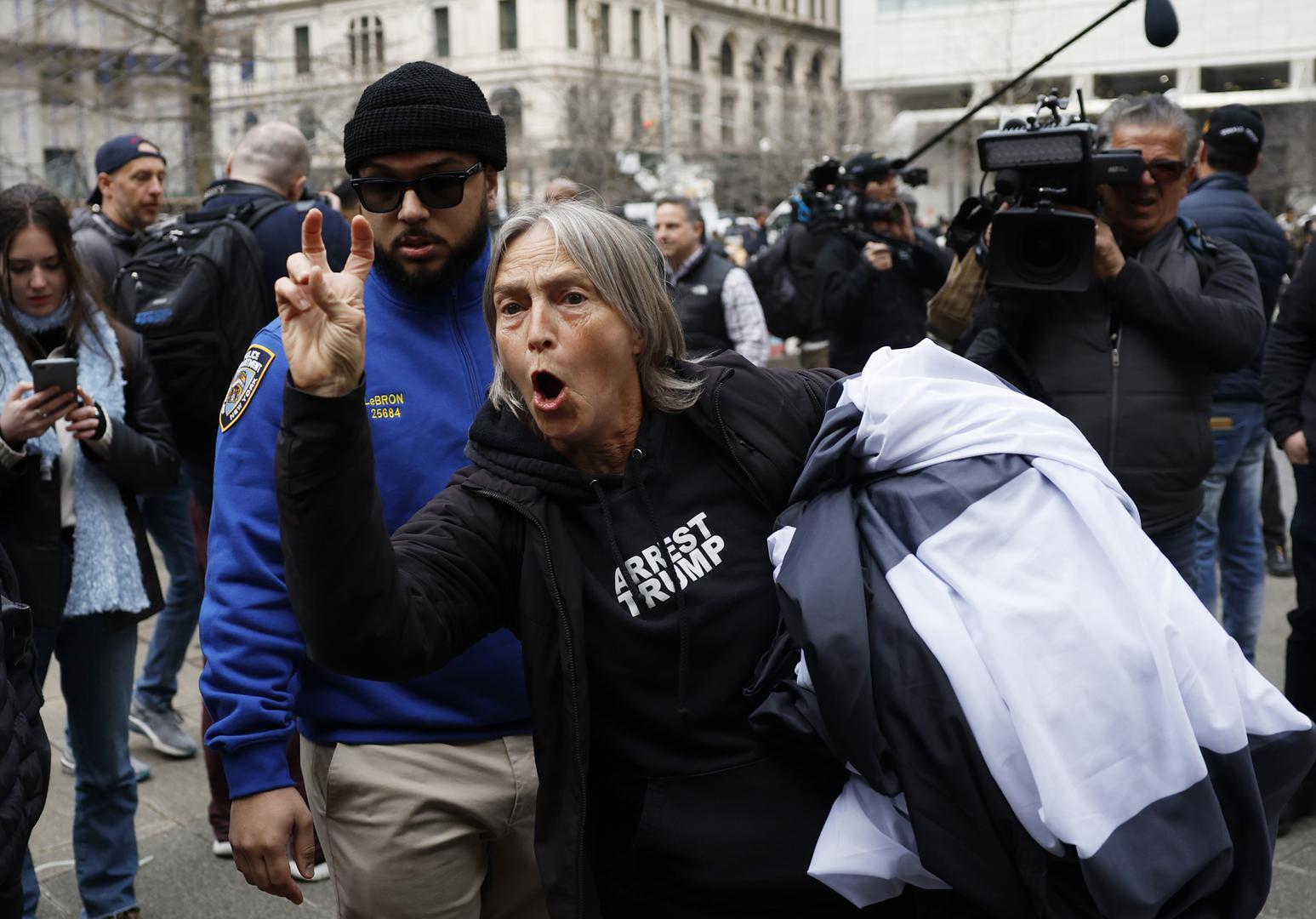 Trump Supporters and protesters argue near New York Criminal Court at 100 Centre Street awaiting the arrival and the arraignment of Former President Donald Trump after a grand jury indictment in New York City on Tuesday, April 4, 2023. Donald Trump was indicted Thursday by a Manhattan grand jury on more than 30 counts related to business fraud. Manhattan District Attorney Alvin Bragg has been investigating the former president in connection with his alleged role in a hush money payment scheme and cover-up involving adult film star Stormy Daniels. Photo by John Angelillo/UPI Photo via Newscom Photo: John Angelillo/NEWSCOM