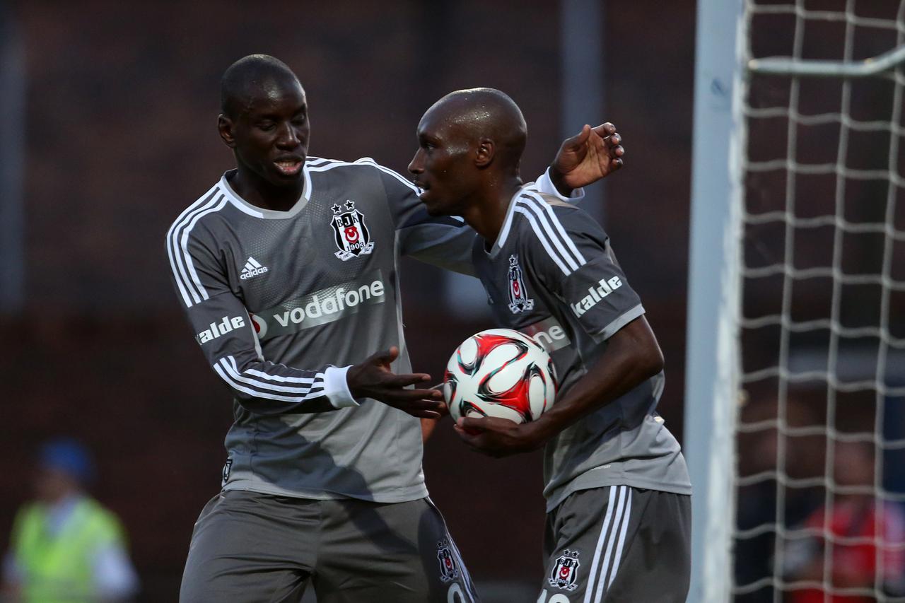 Soccer - Pre Season Friendly - Besiktas v FSV Mainz 05 - Moss Rose Besiktas' Demba Ba congratulates Atiba Hutchinson (right) on scoring.Lynne Cameron Photo: Press Association/PIXSELL