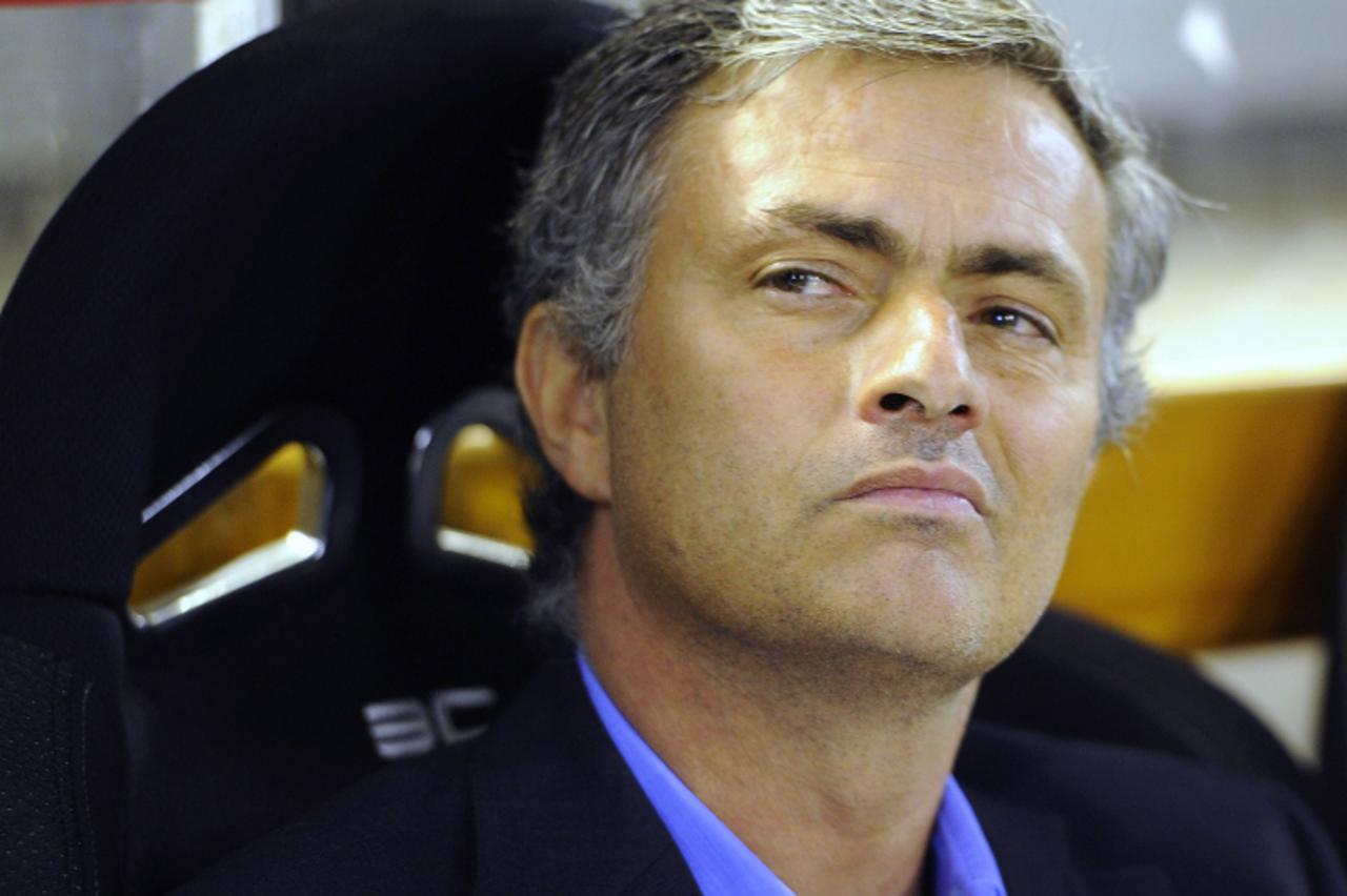 'Real Madrid\'s coach Jose Mourinho waits for the start of the King\'s Cup final soccer match against Barcelona at Mestalla stadium in Valencia April 20, 2011.  REUTERS/Felix Ordonez (SPAIN  - Tags: S