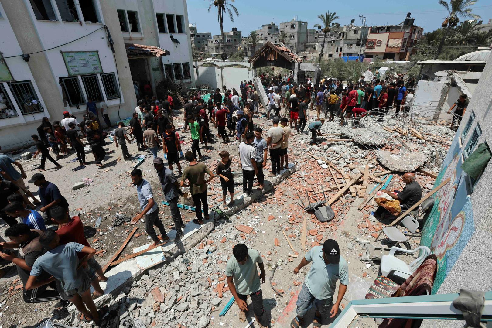 Palestinians inspect a school sheltering displaced people following an Israeli strike, amid Israel-Hamas conflict, in Deir Al-Balah in the central Gaza Strip, July 27, 2024. REUTERS/Ramadan Abed Photo: Ramadan Abed/REUTERS