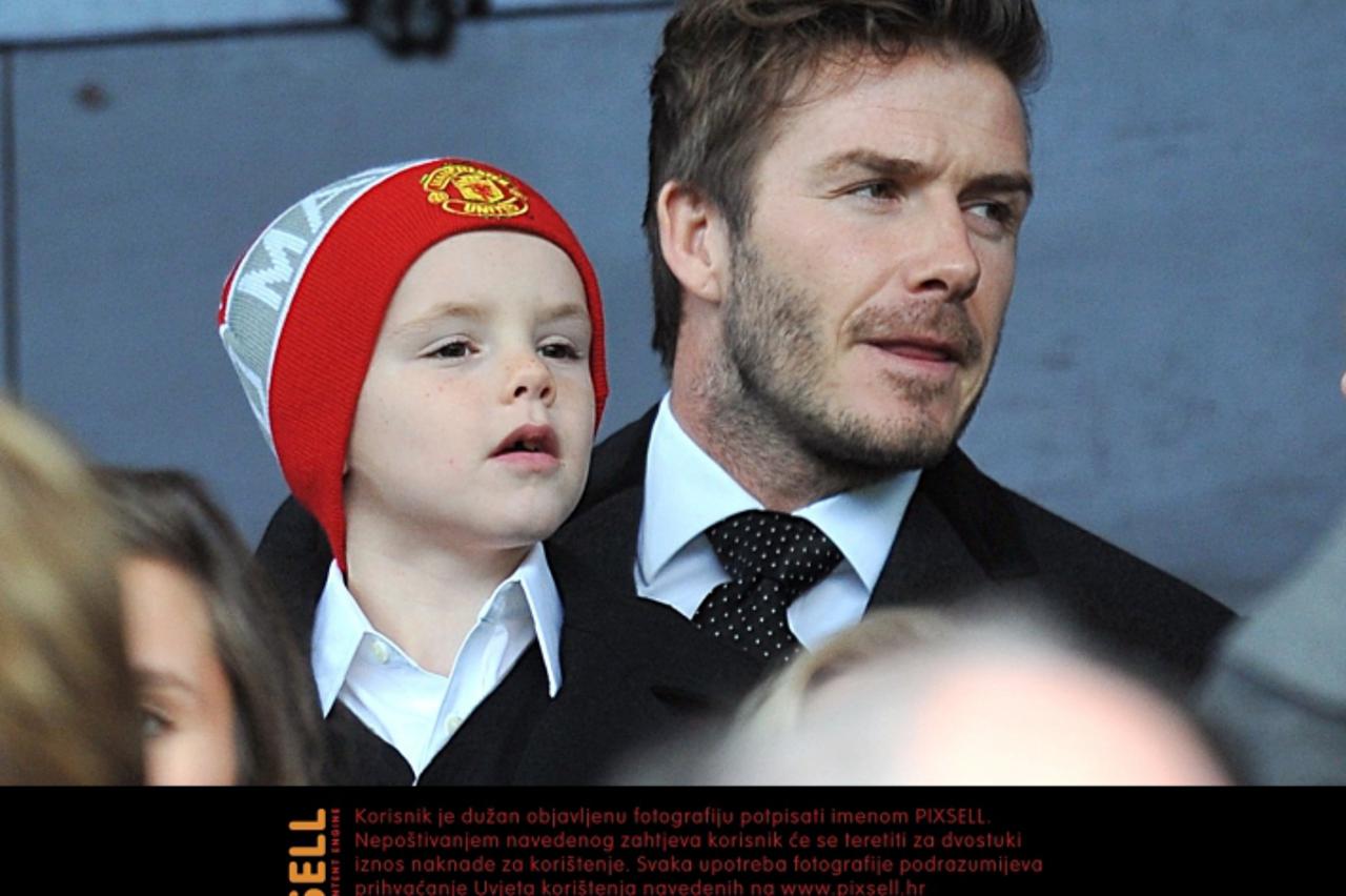 'David Beckham with his son Romeo, in the stands prior to kick-off Photo: Press Association/Pixsell'