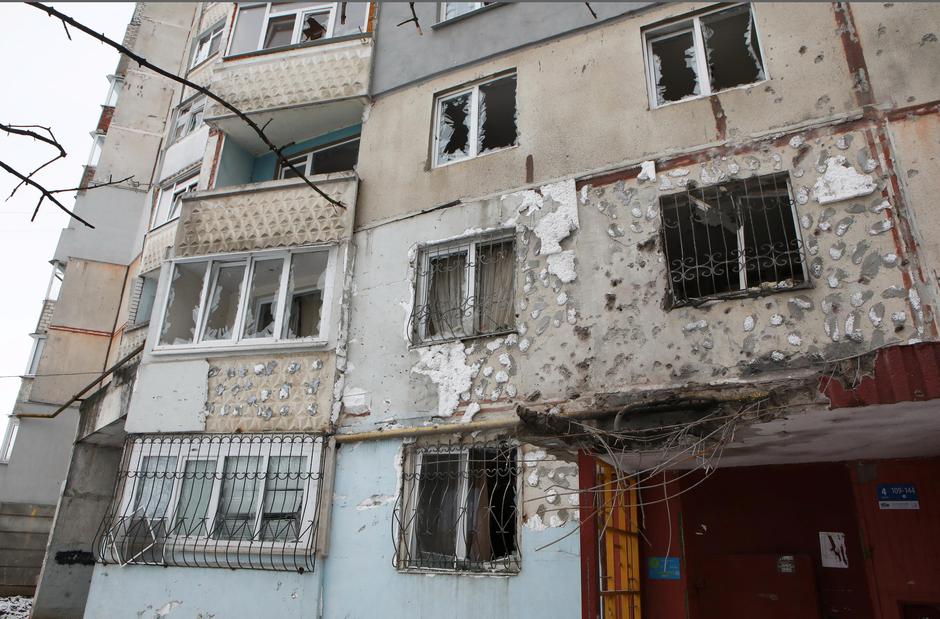 A view shows a damaged residential building in Kharkiv