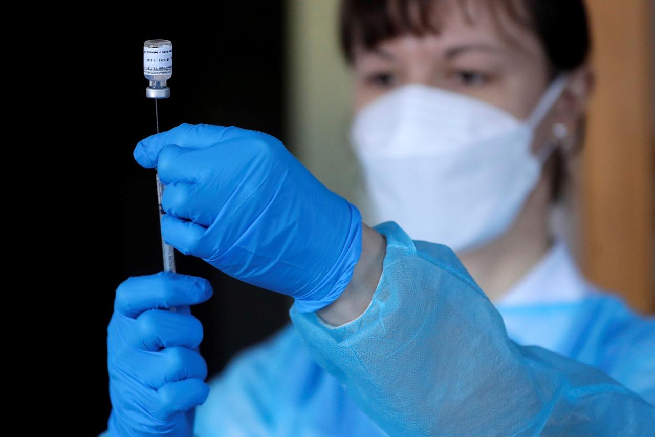 FILE PHOTO: Members of a mobile COVID vaccination team in Prague