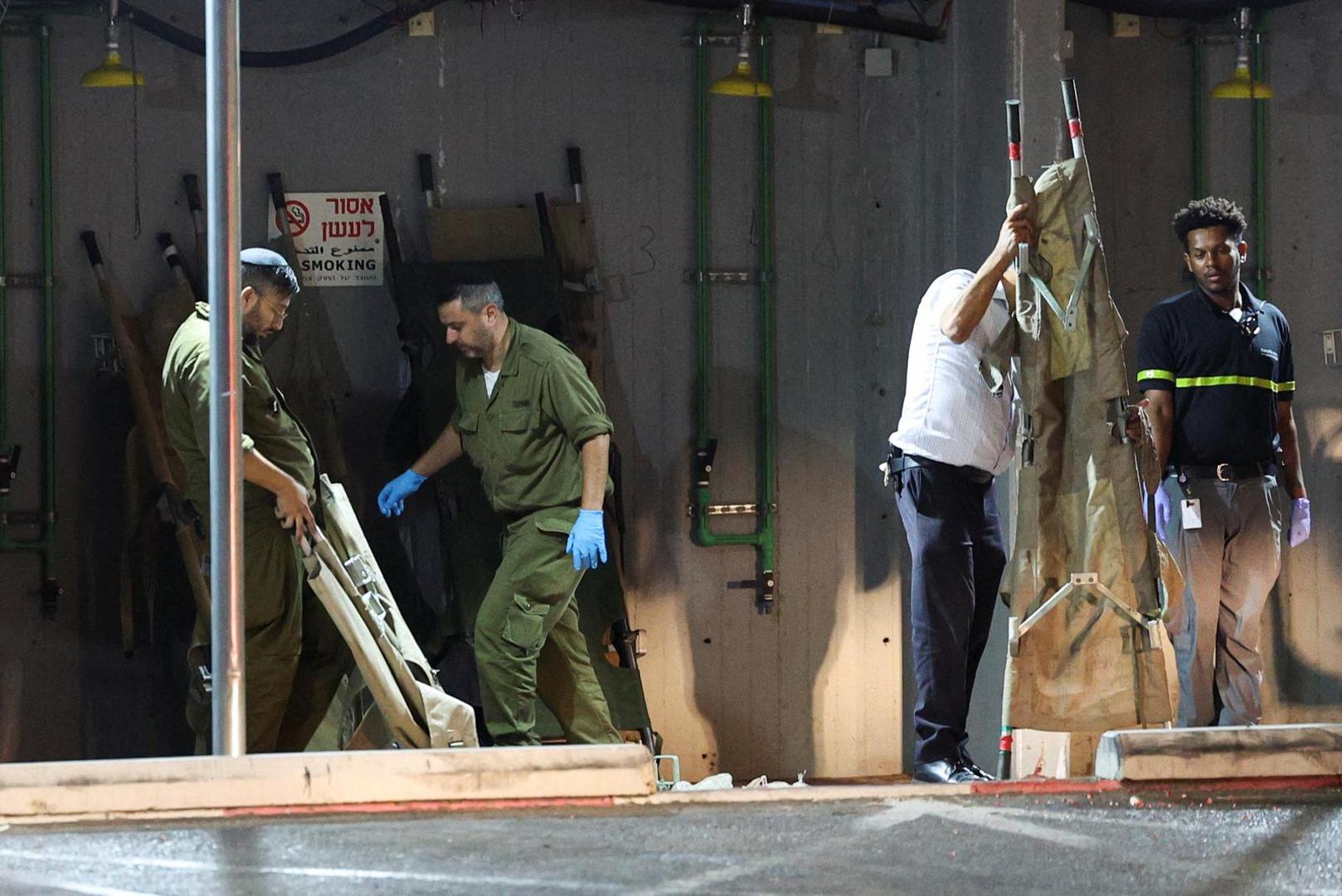 Israeli soldiers and other people fold gurneys following a drone attack from Lebanon, amid cross-border hostilities between Hezbollah and Israel, at Sheba Medical Centre in Ramat Gan, Israel October 13, 2024. Lebanon's Hezbollah claimed responsibility for the attack. REUTERS/Violeta Santos Moura Photo: VIOLETA SANTOS MOURA/REUTERS