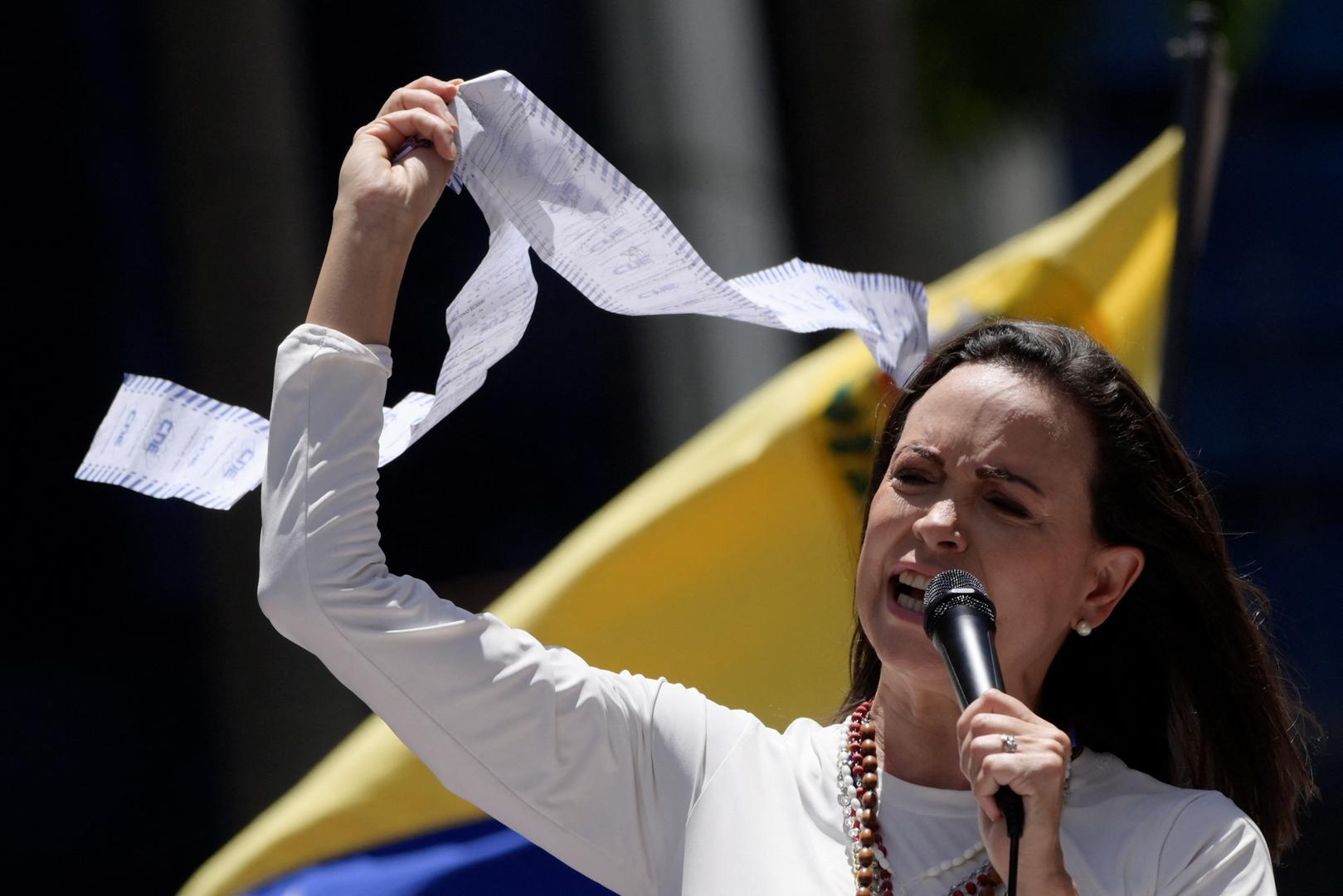 Venezuelan opposition leader Maria Corina Machado speaks as she holds up a copy of electoral records during a protest against the election results announced by President Nicolas Maduro's government after he was declared winner of the election, in Caracas, Venezuela, August 28, 2024. REUTERS/Maxwell Briceno Photo: Maxwell Briceno/REUTERS