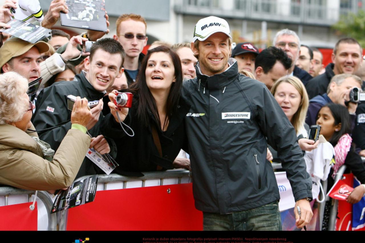 'Great Britain\'s Formula 1 World Champion Jenson Button poses with fans during an appearance at Bluewater shopping centre in Greenhithe, Kent. Photo: Press Association/Pixsell'