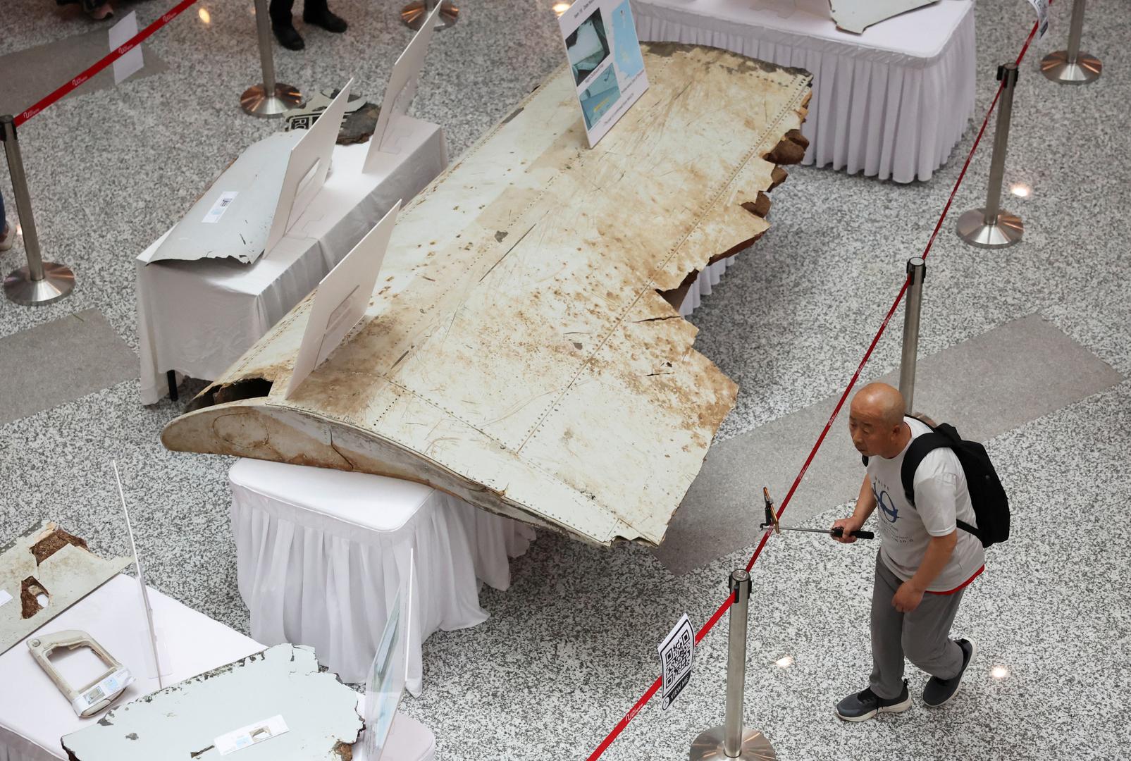 A visitor looks at the wreckage of an aircraft believed to be from the missing Malaysia Airlines flight MH370 during a remembrance event marking the 10th anniversary of its disappearance, in Subang Jaya, Malaysia March 3, 2024. REUTERS/Hasnoor Hussain Photo: HASNOOR HUSSAIN/REUTERS