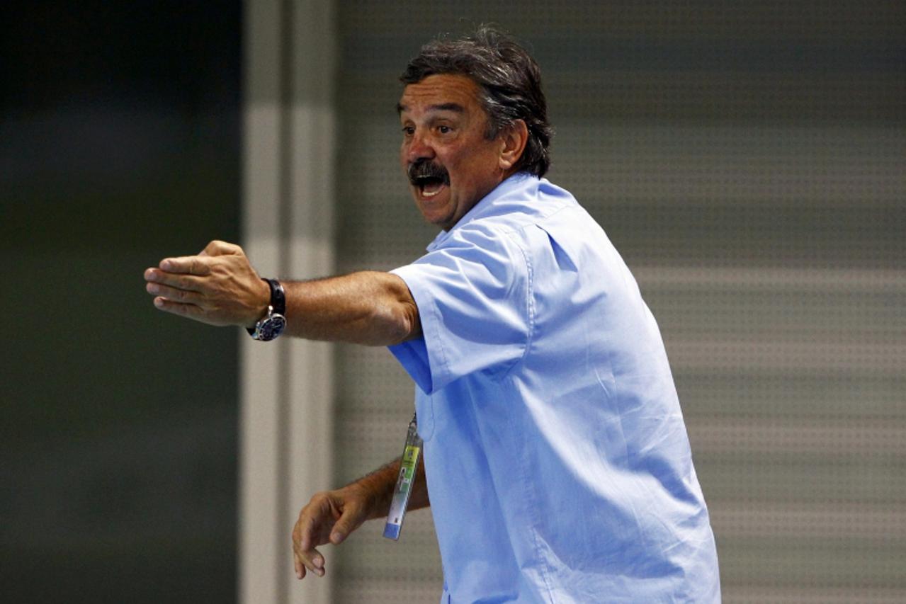 'Croatia\'s head coach Ratko Rudic gives his players instructions during their men\'s water polo quarter-final match against Montenegro at the 14th FINA World Championships in Shanghai July 26, 2011. 