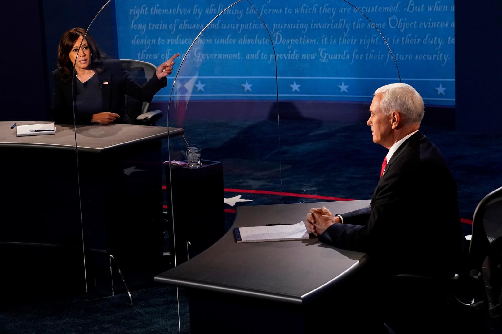 U.S. 2020 vice presidential debate Democratic vice presidential nominee and U.S. Senator Kamala Harris answers a question as U.S. Vice President Mike Pence watches, during the 2020 vice presidential debate on the campus of the University of Utah in Salt Lake City, Utah, U.S., October 7, 2020.  Morry Gash/Pool via REUTERS POOL