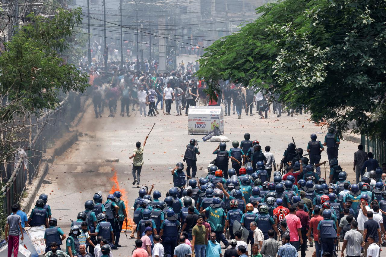 Anti-quota supporters clash with police and Awami League supporters at the Rampura area in Dhaka