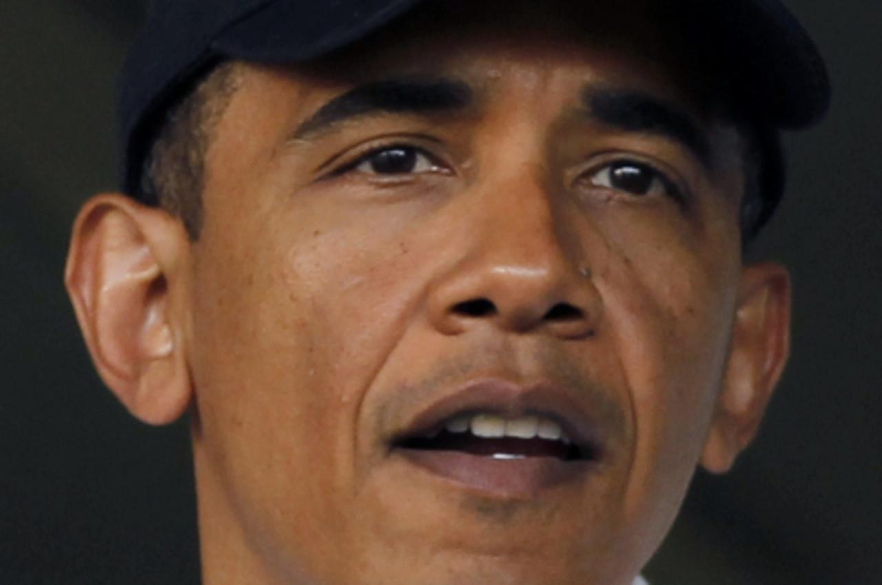 'U.S. President Barack Obama, wearing a Chicago White Sox cap, attends the Washington Nationals vs Chicago White Sox inter-league baseball game at Nationals Stadium in Washington, June 18, 2010 (HEADS