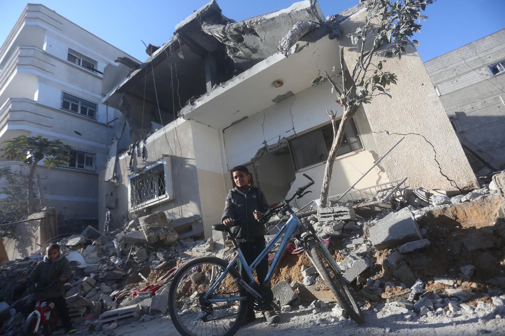 (240221) -- RAFAH, Feb. 21, 2024 (Xinhua) -- Children pass by the rubble of a building destroyed in an Israeli air strike in the southern Gaza Strip city of Rafah, on Feb. 21, 2024. The Palestinian death toll in the Gaza Strip has risen to 29,313, with 69,333 others wounded, as the Israel-Hamas conflict continues, the Hamas-run Health Ministry said in a press statement on Wednesday.    During the past 24 hours, the Israeli army killed 118 Palestinians and wounded 163 others in the coastal enclave, it added. (Photo by Khaled Omar/Xinhua) Photo: Khaled Omar/XINHUA