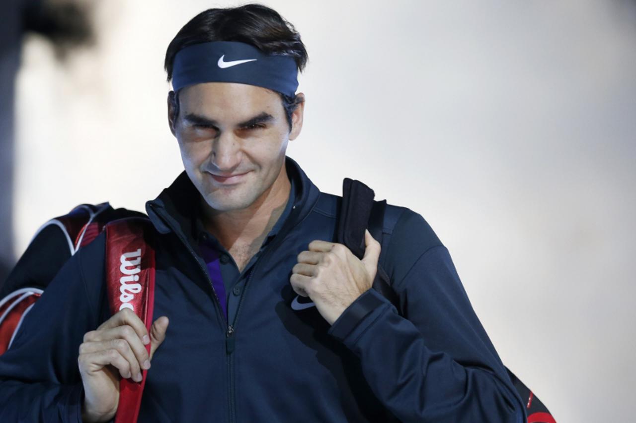 'Switzerland\'s Roger Federer arrives for his final tennis match at the ATP World Tour Finals against Serbia\'s Novak Djokovic at the O2 Arena in London November 12, 2012. REUTERS/Suzanne Plunkett (BR