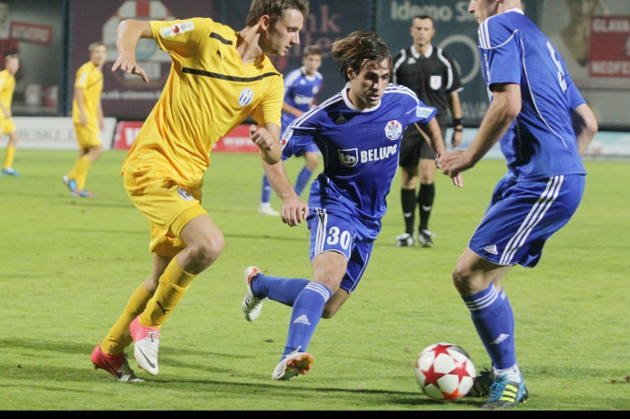 '24.08.2012., Koprivnica - Gradski stadion, 1. HNL, 6. kolo MAXtv. NK Slaven Belupo - NK Lokomotiva.Martin Saban, Ante Batarelo i Andrej Kramaric. Photo: Marijan Susenj/PIXSELL'