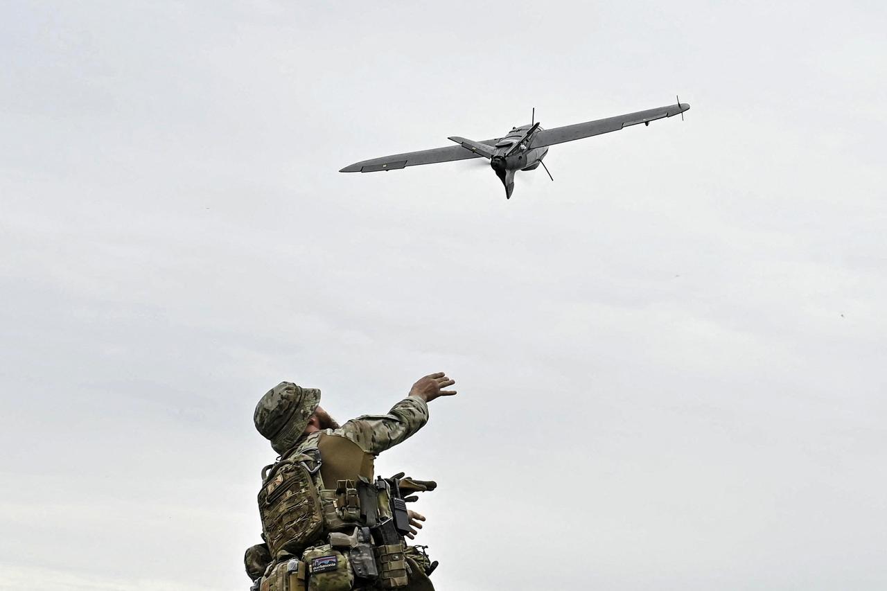 A Ukrainian serviceman launches a reconnaissance drone for flying over positions of Russian troops in Zaporizhzhia