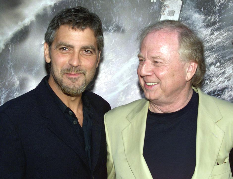 FILE PHOTO: Actor George Clooney, star of the film "The Perfect Storm," poses with the film's German director Wolfgang Petersen at the film's premiere in Los Angeles