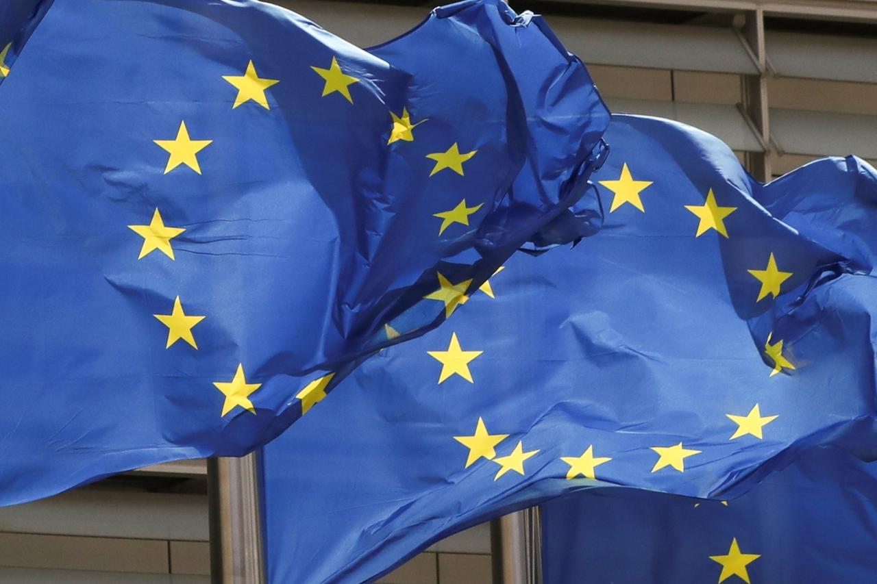 European Union flags flutter outside the EU Commission headquarters in Brussels