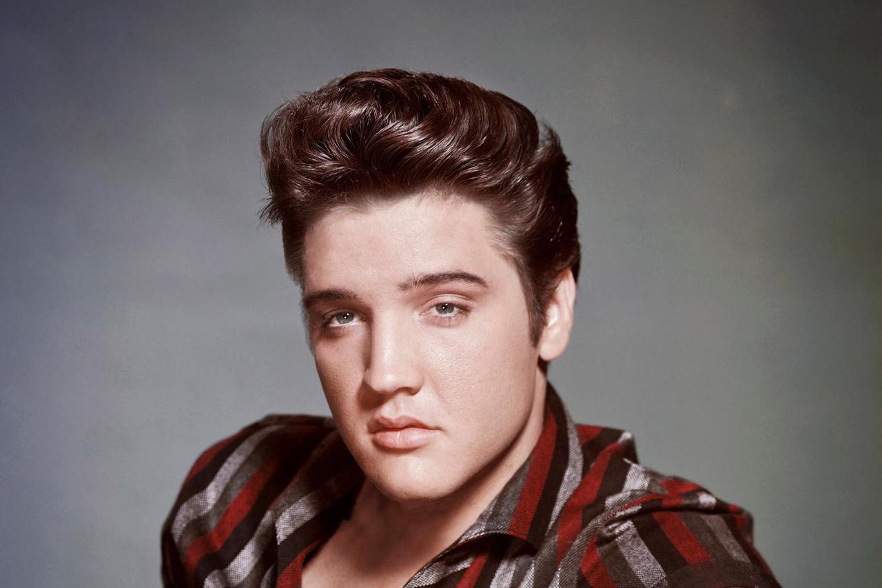 Elvis Presley poses in a studio portrait