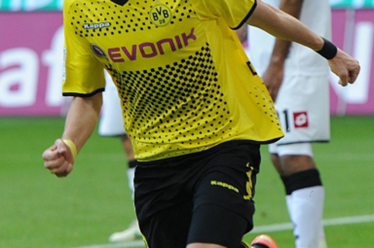 'Dortmund\'s Croatian midfielder Ivan Perisic celebrates after scoring during the German first division Bundesliga football match Borussia Dortmund vs Borussia Moenchengladbach in the German city of D