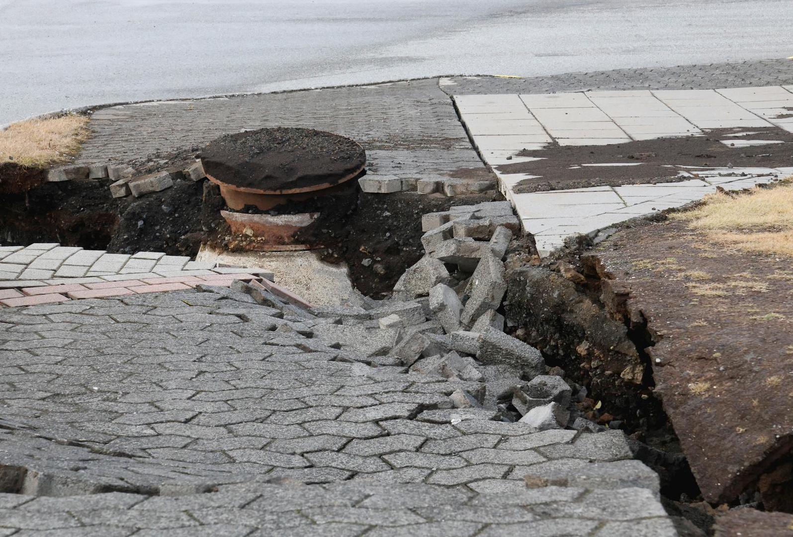 A road is damaged in the village of Grindavik, which was evacuated due to volcanic activity, in Iceland November 14, 2023. REUTERS/Ben Makori Photo: BEN MAKORI/REUTERS