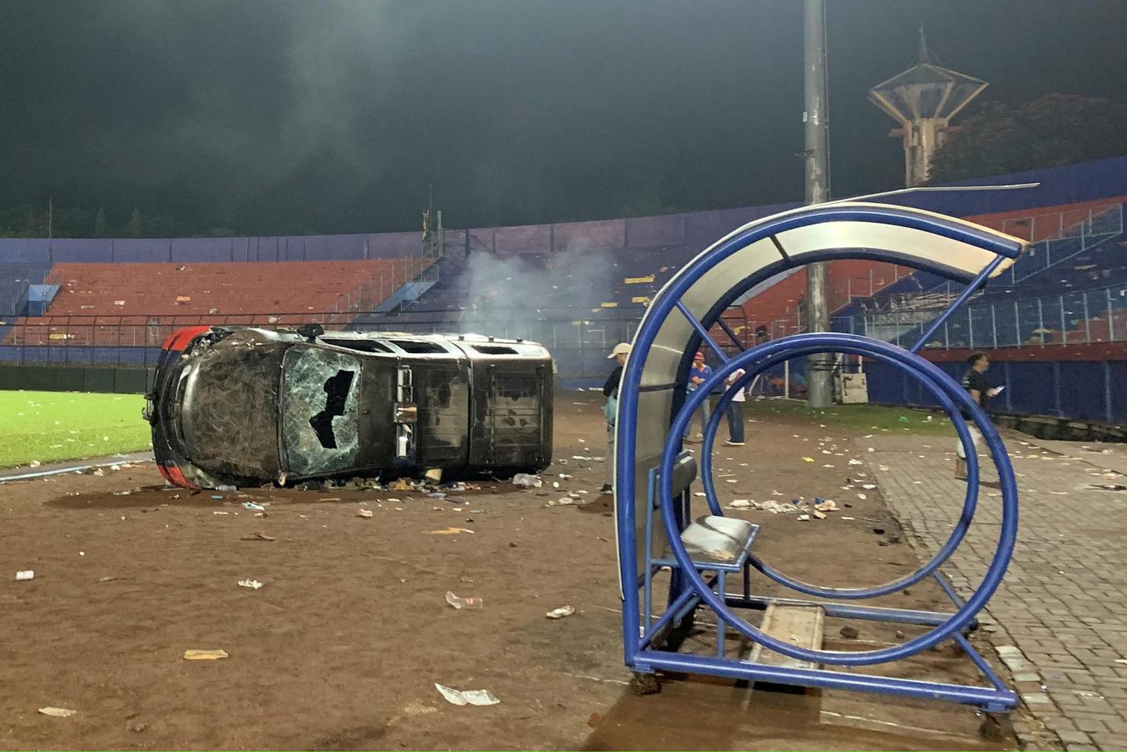 A damaged car is pictured following a riot after the league BRI Liga 1 football match between Arema vs Persebaya at Kanjuruhan Stadium, Malang, East Java province, Indonesia, October 2, 2022, in this photo taken by Antara Foto. Antara Foto/Ari Bowo Sucipto/via REUTERS    Antara Foto/via REUTERS    ATTENTION EDITORS - THIS IMAGE HAS BEEN SUPPLIED BY A THIRD PARTY. MANDATORY CREDIT. INDONESIA OUT. NO COMMERCIAL OR EDITORIAL SALES IN INDONESIA. Photo: ANTARA FOTO/REUTERS