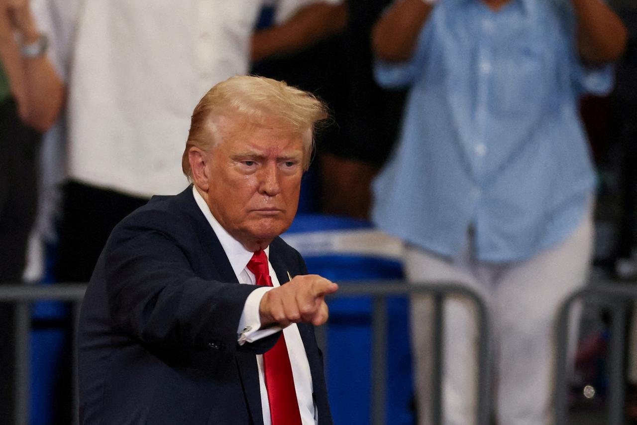 FILE PHOTO: FILE PHOTO: Republican presidential nominee and former U.S. President Donald Trump and his running mate JD Vance hold a campaign rally in Atlanta, Georgia