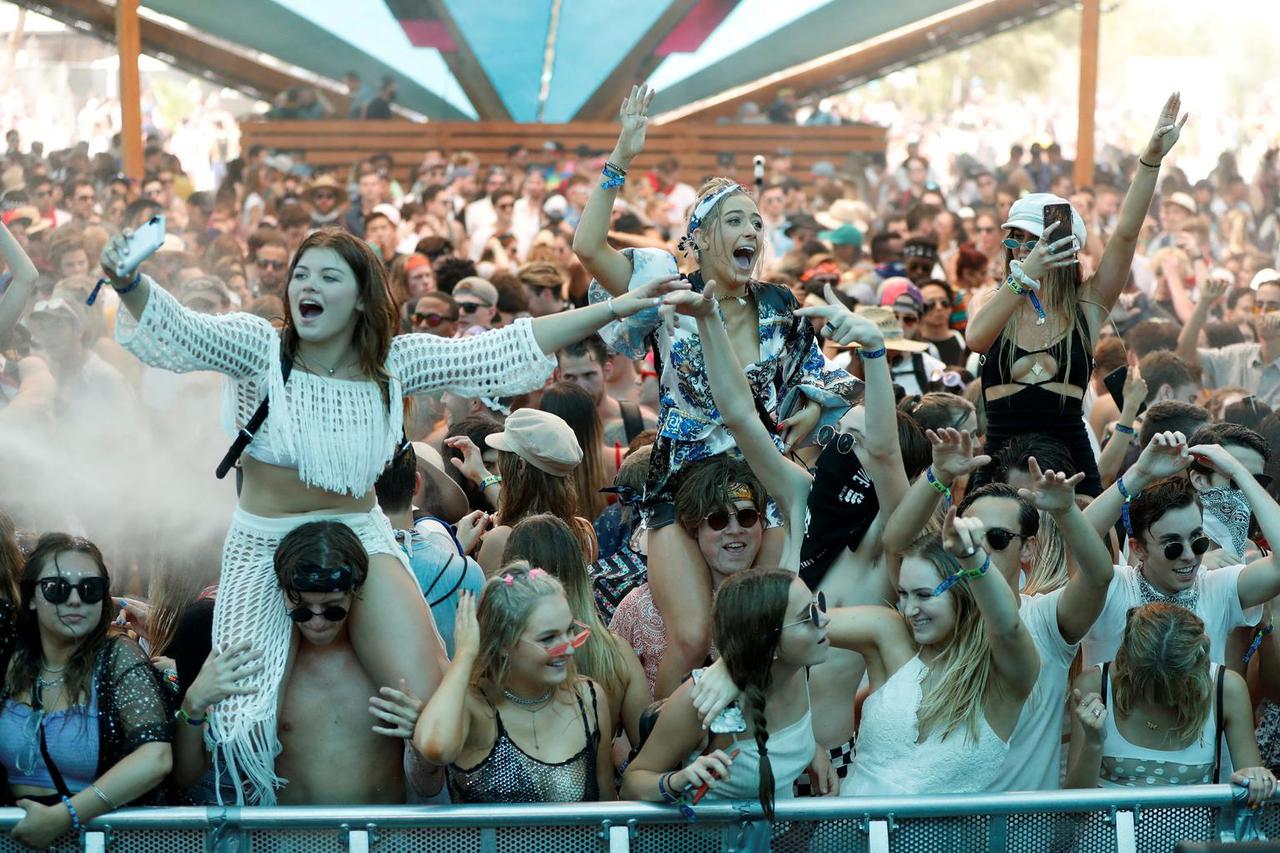 FILE PHOTO: Concertgoers dance at the Do LaB stage at the Coachella Valley Music and Arts Festival in Indio