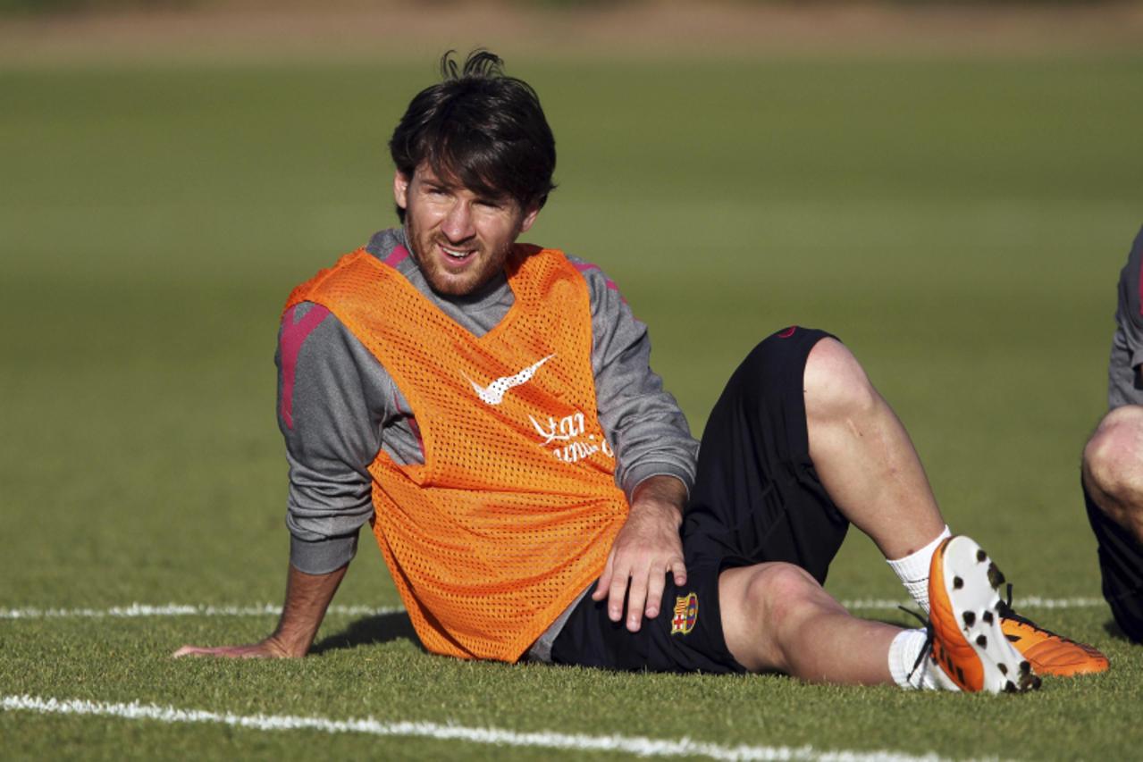 'Barcelona\'s Lionel Messi attends a training session at Arsenal\'s football training camp at London Colney in this handout photograph taken May 25, 2011. Barcelona and Manchester United will play the