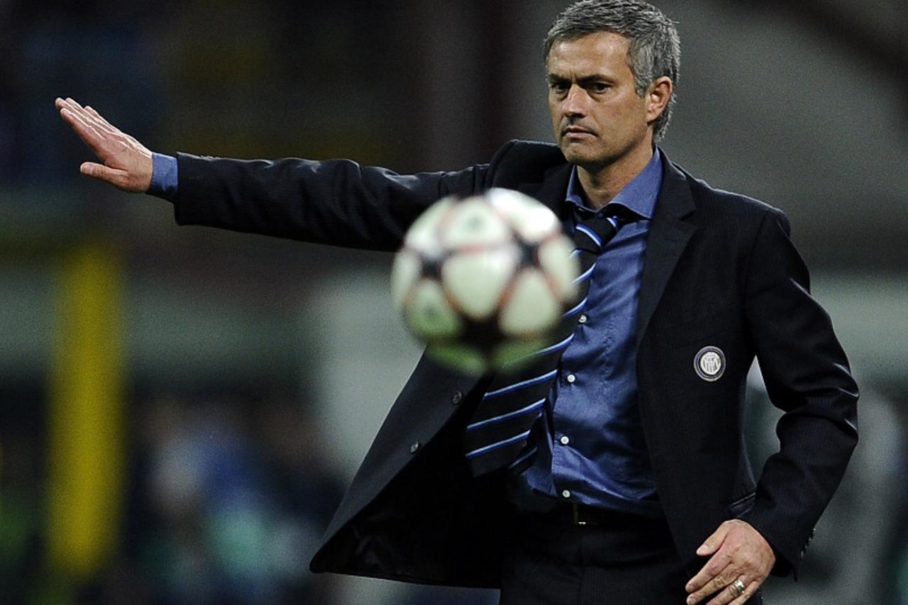 'Inter Milan\'s Portuguese coach Jose Mourinho gestures during their UEFA Champions League first leg semifinal football match on April 20, 2010 in Milan\'s San Siro stadium. Milan won 3-1.  AFP PHOTO/