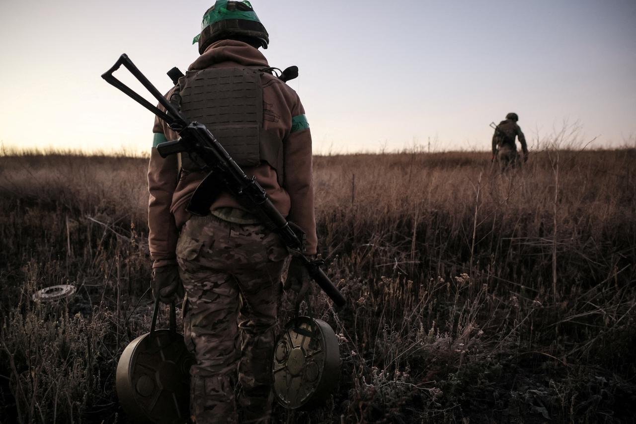 Sappers prepare to install anti-tank landmines on the outskirts of the town of Chasiv Yar